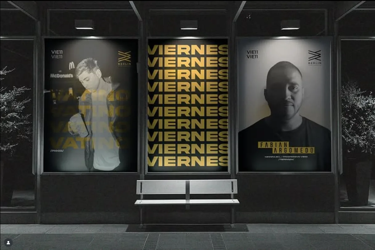 Berlin Club posters in a bus-stop shelter at night